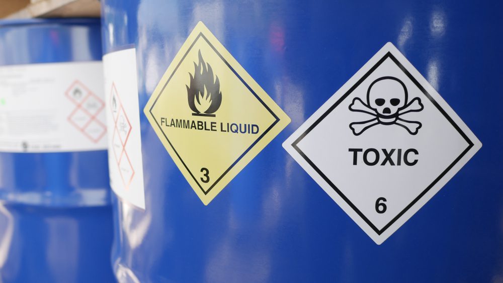 Toxic,And,Flammable,Label,On,Barrels,In,Outdoor,Storage,Yard