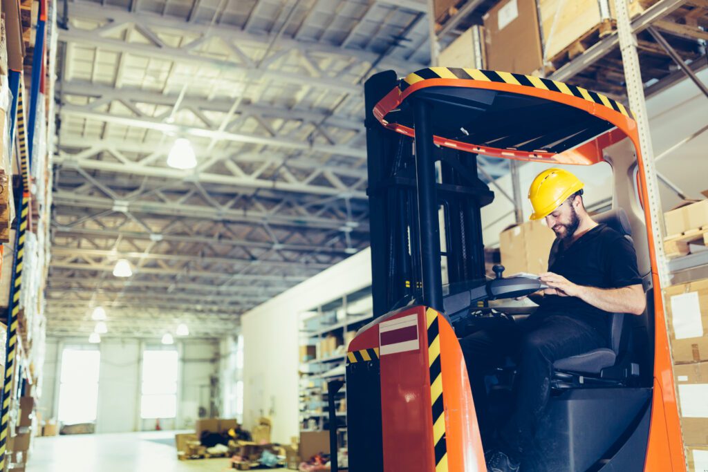 man using a forklift